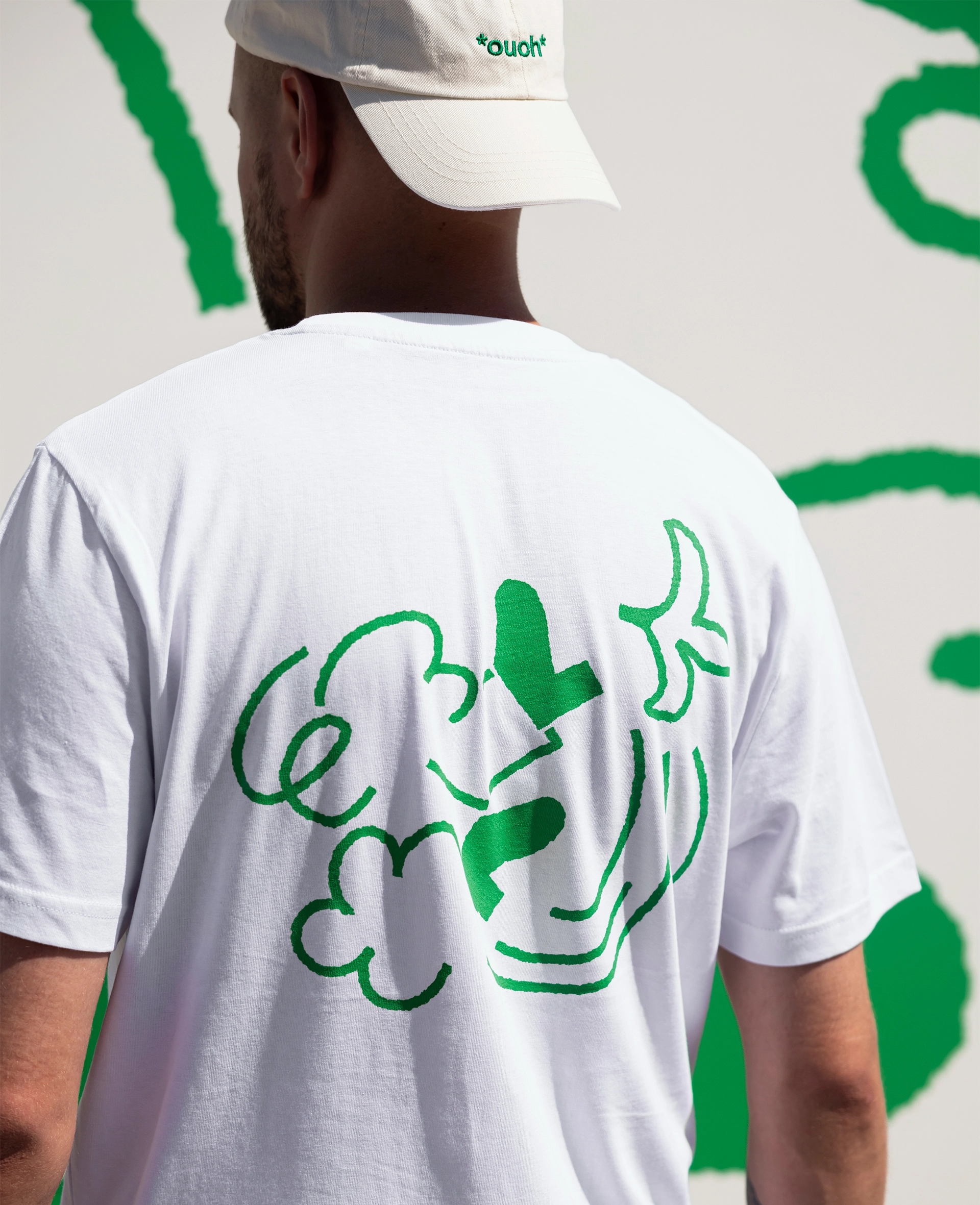 ouch_tshirtback_frontpage99